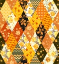 Beautiful sunny patchwork with yellow flowers and leaves. Seamless pattern with floral and geometric ornaments. Textile print Royalty Free Stock Photo