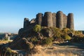 Beautiful sunny view of Amberd fortress, Mount Aragats with horse pasturing, Aragatsotn, Armenia in a summer day