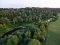 A beautiful sunny view of the forest, fields and river from above with a drone Royalty Free Stock Photo