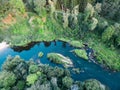 A beautiful sunny view of the forest, fields and river from above with a drone Royalty Free Stock Photo