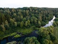 A beautiful sunny view of the forest, fields and river from above with a drone Royalty Free Stock Photo