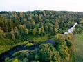 A beautiful sunny view of the forest, fields and river from above with a drone Royalty Free Stock Photo