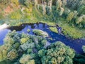 A beautiful sunny view of the forest, fields and river from above with a drone Royalty Free Stock Photo