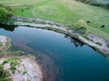 A beautiful sunny view of the forest, fields and river from above with a drone Royalty Free Stock Photo