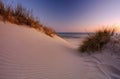 Sunrise on the Baltic Sea coast, sand dunes, beach, Dzwirzyno, Poland. Royalty Free Stock Photo