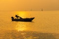 .Beautiful sunrise on the beach and silhouette of fishing boat.Thailand Royalty Free Stock Photo