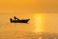 .Beautiful sunrise on the beach and silhouette of fishing boat.Thailand Royalty Free Stock Photo