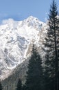 Beautiful sunrise in Caucasus mountains in winter. Mountain ridges highlighted the low winter sun. Royalty Free Stock Photo