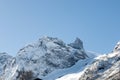 Beautiful sunrise in Caucasus mountains in winter. Mountain ridges highlighted the low winter sun. Royalty Free Stock Photo