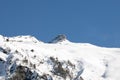 Beautiful sunrise in Caucasus mountains in winter. Mountain ridges highlighted the low winter sun. Royalty Free Stock Photo