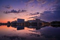 Beautiful sunrise cityscape scene on a lake with mirror reflection