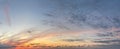 Beautiful sunrise with dark cloud, gold sun and blue sky. Panoramic nature background