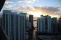 Beautiful sunrise in downtown miami. the sun breaks through the clouds and skyscrapers. view from the 38th floor