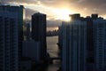 Beautiful sunrise in downtown miami. the sun breaks through the clouds and skyscrapers. view from the 38th floor