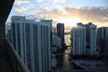 Beautiful sunrise in downtown miami. the sun breaks through the clouds and skyscrapers. view from the 38th floor