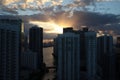 Beautiful sunrise in downtown miami. the sun breaks through the clouds and skyscrapers. view from the 38th floor