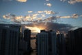 Beautiful sunrise in downtown miami. the sun breaks through the clouds and skyscrapers. view from the 38th floor