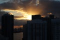 Beautiful sunrise in downtown miami. the sun breaks through the clouds and skyscrapers. view from the 38th floor