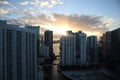 Beautiful sunrise in downtown miami. the sun breaks through the clouds and skyscrapers. view from the 38th floor