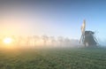 Beautiful sunrise in Dutch countryside with windmill Royalty Free Stock Photo