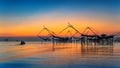 Beautiful sunrise and fishing dip nets at Pakpra in Phatthalung Royalty Free Stock Photo
