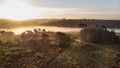 Beautiful sunrise image of drone aerial view of Autumn Fall forest scene landscape Royalty Free Stock Photo