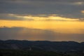 Beautiful sunrise of Judean Desert wadi, with sun rays breaking through clouds over the dry riverbed of Nahal Dragot popular Royalty Free Stock Photo