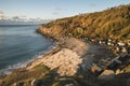 Beautiful sunrise landscape image of Church Ope Cove in Portland