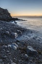 Beautiful sunrise landscape image of Church Ope Cove in Portland