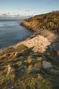 Beautiful sunrise landscape image of Church Ope Cove in Portland