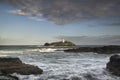 Beautiful sunrise landscape image of Godrevy in Corwnall England