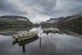 Beautiful Winter landscape image of Llyn Nantlle in Snowdonia Na