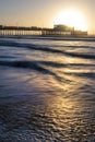 Beautiful vibrant sunrise landscape image of Worthing pier in West Sussex during Winter Royalty Free Stock Photo