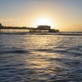 Beautiful vibrant sunrise landscape image of Worthing pier in West Sussex during Winter Royalty Free Stock Photo