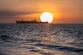 Beautiful sunrise landscape over black sea. Sun rise over ship wreck Royalty Free Stock Photo