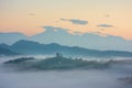 Beautiful sunrise landscape of Saint Thomas Church in Slovenia on hilltop in the morning fog