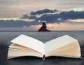 Beautiful sunrise landsdcape of idyllic Broadhaven Bay beach on Pembrokeshire Coast in Wales coming out of pages in a book