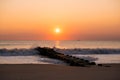 Sunrise over a jetty at Rehoboth Beach in Delaware Royalty Free Stock Photo