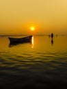 Landscape showing a beautiful sunrise on the Ganges river in the city of Allahabad, India. Royalty Free Stock Photo