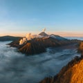 Beautiful sunrise at Mount Bromo with eruption of Mount Semerio. Aerial Drone Shot. Active volcano in Bromo Tengger