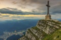 Beautiful sunrise in the mountains and Caraiman Heroes Cross Monument in Bucegi mountains,Carpathians,Romania