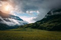 Beautiful sunrise in mountains with white fog below. Misty morning in mountain, Altai, Russia. A foggy landscape with cloudy sky Royalty Free Stock Photo