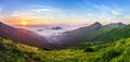 Beautiful sunrise in mountains with white fog below panorama Royalty Free Stock Photo