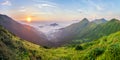 Beautiful sunrise in mountains with white fog below panorama Royalty Free Stock Photo