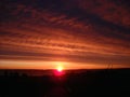 Beautiful sunrise in the north. Cloudy morning with a dawn over Lake Onega. On the horizon are the Ivanovo Islands. Industrial Royalty Free Stock Photo