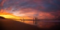 Beautiful sunrise of old jetty piles at St. Clair Beach in Dunedin, New Zealand