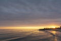 Beautiful sunrise on the old sea pier