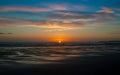 The beautiful sunrise, orange blue sky and clouds over the Blyth Beach. Royalty Free Stock Photo