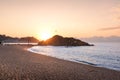 Sunrise over Blanes beach and view of Sa Palomera rock in Spain Royalty Free Stock Photo