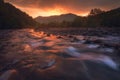 Sunrise over fast mountain river Royalty Free Stock Photo